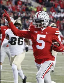  ?? AP FILE ?? Receiver Garrett Wilson and No. 4 Ohio State face No. 7 Michigan State today.