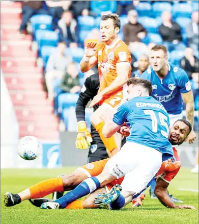  ??  ?? GOALBOUND: Shrewsbury’s Stefan Payne makes it 1-0