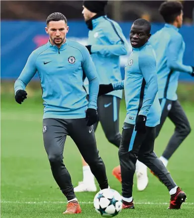  ??  ?? Leicester connection: Danny Drinkwater (left) and N’Golo Kante attending Chelsea’s training session in London yesterday. Chelsea face Atletico Madrid in the Champions League today. — / AFP