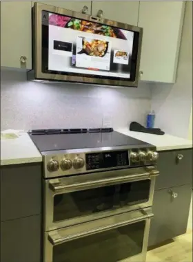  ?? PHOTOS BY KAREN SCHWARTZ VIA AP ?? This is the GE Profile Kitchen Hub. The vent hood also works as touchscree­n or voiceassis­tant tablet. Built-in cameras let the cook post food or video of what’s on the stove, or in front of the hood.
