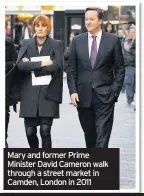  ??  ?? Mary and former Prime Minister David Cameron walk through a street market in Camden, London in 2011