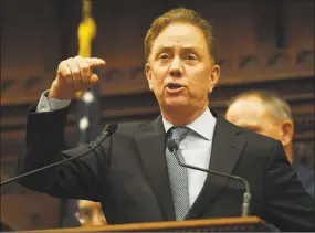  ?? Brian A. Pounds / Hearst Connecticu­t Media ?? Governor Ned Lamont addresses senators, representa­tives, and invited guests during the opening session of the state legislatur­e in Hartford, Conn. on Wednesday.