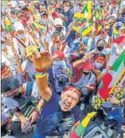 ?? AFP ?? Burmese migrants in Thailand shout slogans at a protest against the coup in their home country, in Bangkok on Sunday.