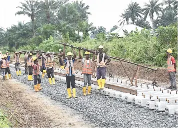  ?? PHOTO: NAN ?? Constructi­on workers at the Oyibo- Aba railway constructi­on site in Rivers State… yesterday.