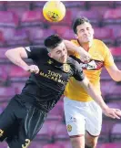  ??  ?? Eyes wide shut Carl Mchugh challenges Livi’s Declan Gallagher