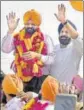  ??  ?? Victorious Akali candidate Manpreet Singh Ayali with party leader Bikram Singh Majithia in Dakha. HT PHOTO