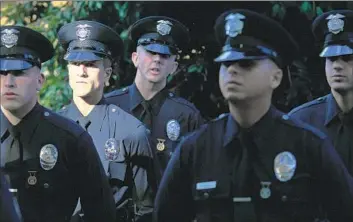  ?? Brian van der Brug Los Angeles Times ?? LAPD recruits assemble for graduation exercises in 2013. To achieve its goal of hiring 780 recruits in the next fiscal year, the LAPD would need 13 recruit classes of at least 60 people. But recent classes have averaged 34.