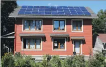  ?? JEAN LEVAC ?? EcoHaus draws power from rooftop photovolta­ic solar panels.