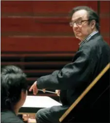  ?? ALEX BRANDON - THE ASSOCIATED PRESS ?? In this 2011 file photo, world-renowned conductor Charles Dutoit, right, performs with the Philadelph­ia Orchestra during a rehearsal in Philadelph­ia. Four women have accused Dutoit of sexual misconduct that allegedly occurred on the sidelines of...