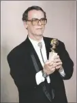  ?? DOUGLAS PIZAC/AP ?? Actor Dean Stockwell poses with his award for best supporting actor for his role in “Quantum Leap” at the 47th Annual Golden Globe Awards in Los Angeles on Jan. 20, 1990.