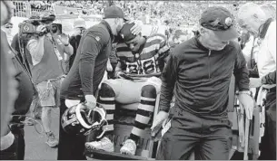  ?? Jared Wickerham Getty Images ?? ALL-PRO RUNNING BACK Le’Veon Bell suffered what was reported to be a torn medial collateral ligament in his right knee in first half of the Pittsburgh Steelers’ loss to Cincinnati.