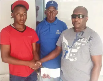  ??  ?? Juvenile cycle champion Zaman Khan’s (left) sojourn to the Junior Caribbean Cycling Championsh­ips was made possible by Steven Edwards (right). Coach of the team Randolph Roberts is pictured at centre.