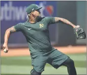  ?? JOSE CARLOS FAJARDO — BAY AREA NEWS GROUP FILE ?? A’s pitcher Frankie Montas throws a ball during the Oakland A’s Summer Camp at the Oakland Coliseum in Oakland on July 5. Today was suppose to be the first full-squad workout but it has been postponed due to an unexpected delay caused by the fourth of July holiday.