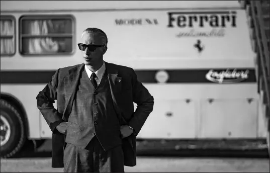  ?? LORENZO SISTI / LEON VIA ASSOCIATED PRESS ?? Adam Driver portrays Enzo Ferrari in a scene from “Ferrari,” a solid film that doesn’t quite get the engines running.