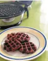  ??  ?? Chocolate cookies, when waffled, make a rich exterior for homemade ice cream sandwiches.