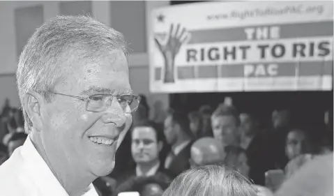  ?? ALAN DIAZ, AP ?? Former Florida governor Jeb Bush talks to people during a fundraiser May 18 in Sweetwater, Fla.