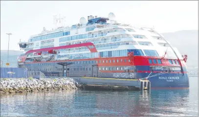  ?? The Associated Press ?? The MS Roald Amundsen is moored in Tromso, Norway, on Monday after more than 40 people, including five passengers and 36 members of the crew on the Norwegian cruise ship, tested positive for COVID-19.