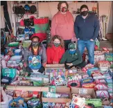  ?? COURTESY DEREK COOKSON ?? Some of the hundreds of toys a small group of Royal Oak volunteers collected for children at Judson
Center during the holidays. Standing, from left, are Doreen Dobson and Clyde Esbri. Seated in front are Dee Mack, Lindsay Warren and Thomas Warren.