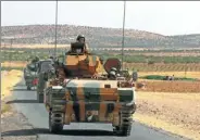 ?? REUTERS ?? A Turkish army convoy drives to their base in Karkamis on the Turkish-Syrian border in the southeaste­rn Gaziantep province, Turkey, on Saturday.