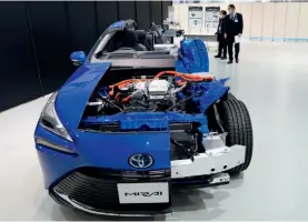  ??  ?? A model of the Mirai hydrogen-powered vehicle developed by Toyota exhibited in Tokyo, Japan, December 9, 2020