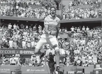  ?? LYNNE SLADKY/AP PHOTO ?? John Isner celebrates after defeating Alexander Zverev in the men’s final at the Miami Open on Sunday at Key Biscayne, Fla. Isner won, 6-7 (4), 6-4, 6-4.