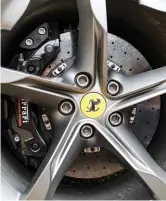  ?? ?? Top: 398mm carbon-ceramic discs (360mm rear) and 20-inch wheels are carried over from the SF90 Stradale