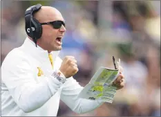  ?? Michael Conroy / Associated Press ?? Minnesota coach P.J. Fleck celebrates a touchdown during a game against Purdue on Sept. 28. The coronaviru­s is preventing prospects from leaving home to visit campuses and is keeping college coaches from traveling to evaluate players across the country.