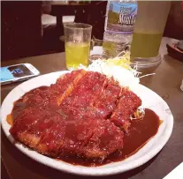  ??  ?? EAT. Gastronomy is one of the reasons why the author travels. Eating what the locals eat excites him, just like this Katsudon he feasted on during a recent trip to Japan.