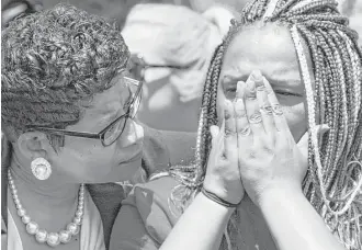  ?? Brett Coomer / Houston Chronicle ?? Geneva Reed-Veal, left, mother of Sandra Bland, comforts her daughter, Shavon Bland, during a ceremony naming Sandra Bland Parkway in Prairie View.