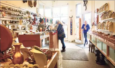  ?? Dan Haar / Hearst Connecticu­t Media ?? Allison Vodola, of Darien, who designs and makes jewelry, visits the Beadworks store in South Norwalk.