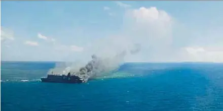  ?? EPA PIC ?? Smoke rising from a burning ferry in waters off East Java province yesterday.