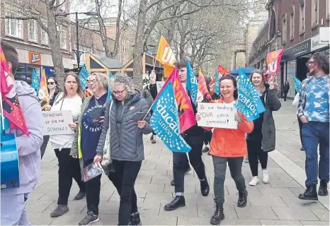  ?? ?? More than 30 teachers took to the streets in Peterborou­gh to walk from St Johns Church in the city centre to Sand Martin House.