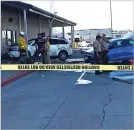  ?? DAMON ARTHUR/ASSOCIATED PRESS ?? Deputies and firefighte­rs stand outside the Red Bluff Walmart distributi­on center Saturday after a man reportedly opened fire there and rammed his vehicle into the building in Red Bluff, Calif.