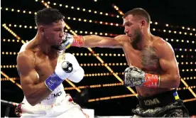  ?? Photograph: Al Bello/Getty Images ?? Vasiliy Lomachenko, right, punches Jamaine Ortiz during their lightweigh­t bout in New York on Saturday night.