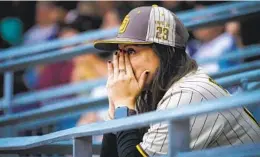  ?? NELVIN C. CEPEDA U-T ?? Padres fan Patricia Rivera lets her nervousnes­s show during the second inning as she watches on the big screen at Petco Park on Saturday.