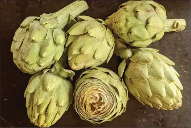  ??  ?? Artichokes are in season now and can be boiled, steamed, fried or stuffed and baked.