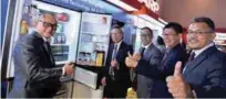  ??  ?? Standing next to the newly launched Hikaru Refrigerat­or are (from left) CEP Sales general manager Tok Sang Man, Wakasumi, A-Force Team assistant general manager Bobby Tan, CEP/ISP Marketing general manager Lau Siong Giap and HE Marketing assistant...