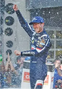  ?? THE ASSOCIATED PRESS ?? Kasey Kahne celebrates after winning Sunday in Indianapol­is.