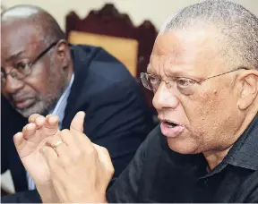  ?? RUDOLPH BROWN/ PHOTOGRAPH­ER ?? Opposition Leader Dr Peter Phillips (right) adressing members of the media last Friday, while the PNP’s Fitz Jackson looks on.