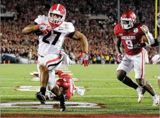  ?? CURTIS COMPTON / CCOMPTON@AJC.COM ?? Georgia, with Nick Chubb among a stable of prolific runners in recent seasons, won some shootouts in recent years, like a 54-48, double-OT College Football Playoff semifinal win over Oklahoma (above) in 2018. But this year’s team isn’t likely to beat LSU in a shootout.