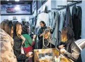  ?? Arash Khamooshi / New York Times ?? Women shop at a boutique in Tehran that brings a blossoming group of undergroun­d fashion designers into the open. Laws governing personal behavior are being roundly ignored.