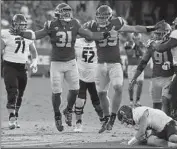  ?? ?? TYRONE TALENI (31) celebrates after the defensive tackle sacked Rice quarterbac­k TJ McMahon.