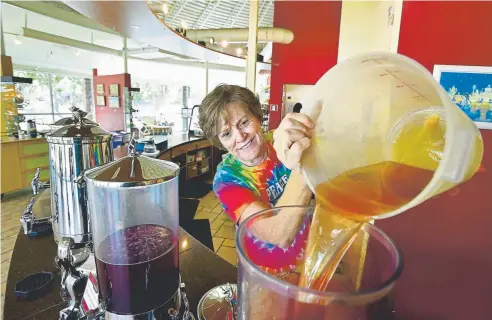  ?? Photos by Jeremy Papasso, Boulder Daily Camera ?? Rochelle Remaly pours citrus sunrise tea into a vessel inside the tasting room at Celestial Seasonings on Sept. 10 in Boulder.