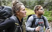  ?? SARAH BLAKE MORGAN / ASSOCIATED PRESS ?? Alexandra Eagle and Jonathan Hall soak up their last moments hiking the Appalachia­n Trail in Cosby, Tennessee, on March 30. They are postponing the 2,190-mile hike till the pandemic ends.