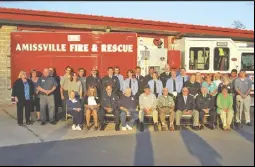  ??  ?? Above left: The members of the Amissville Volunteer Fire and Rescue Company pose in front of one of their fire engines.