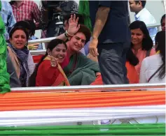  ?? — AFP photo ?? Indian political leader Priyanka Gandhi Vadra, Congress’ general-secretary for eastern Uttar Pradesh, waves to supporter in Sirsa during her boat trip from Allahabad to Varanasi along the Ganges river as part of her election campaign.