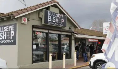  ?? NHAT V. MEYER — STAFF ARCHIVES ?? Shoppers gather outside the Bullseye Bishop in San Jose in March 2020.