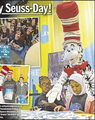  ??  ?? The Cat in the Hat visits schoolchil­dren from the Garden of Dreams Foundation Friday at the Intrepid Sea, Air & Space Museum. The event celebrated of Dr. Seuss’ birthday and Read Across America Day.