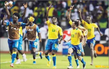  ??  ?? GABON’S Bruno Zita (centre) celebrates his goal against Morocco with team-mates during their African Cup of Nations
Group C match in Libreville on Friday. — Reuters