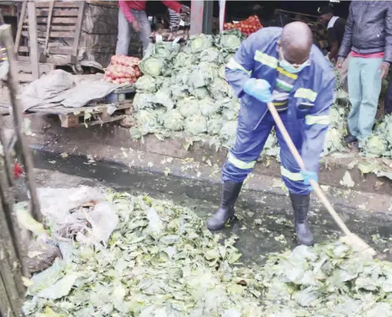  ??  ?? Health Minister Dr Chitalu Chilufya led other ministers and Members of Parliament in cleaning Lusaka’s Soweto market in a bid to fight the spread of Cholera